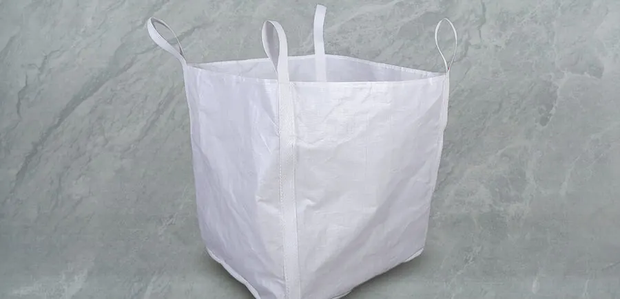 Cross-corner loop FIBC bag with small filling opening