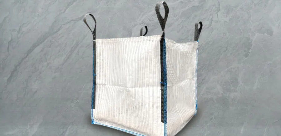 Lock-edge FIBC bag with serged seams and four dark lifting loops